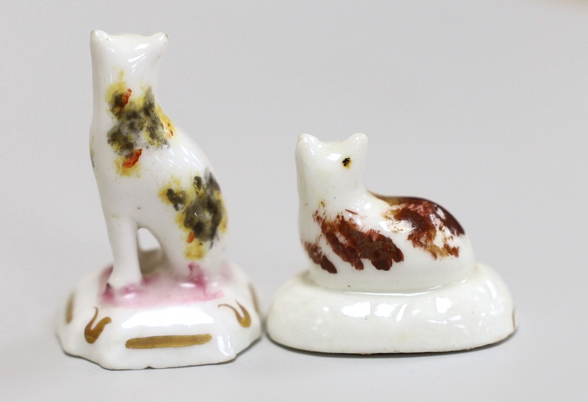 A seated toy Staffordshire cat with tortoiseshell markings, together with a Staffordshire recumbent toy cat with brown markings, c.1830-50, tallest 4cm., Cf. Dennis G.Rice Cats in English porcelain, colour plate 57., Pro